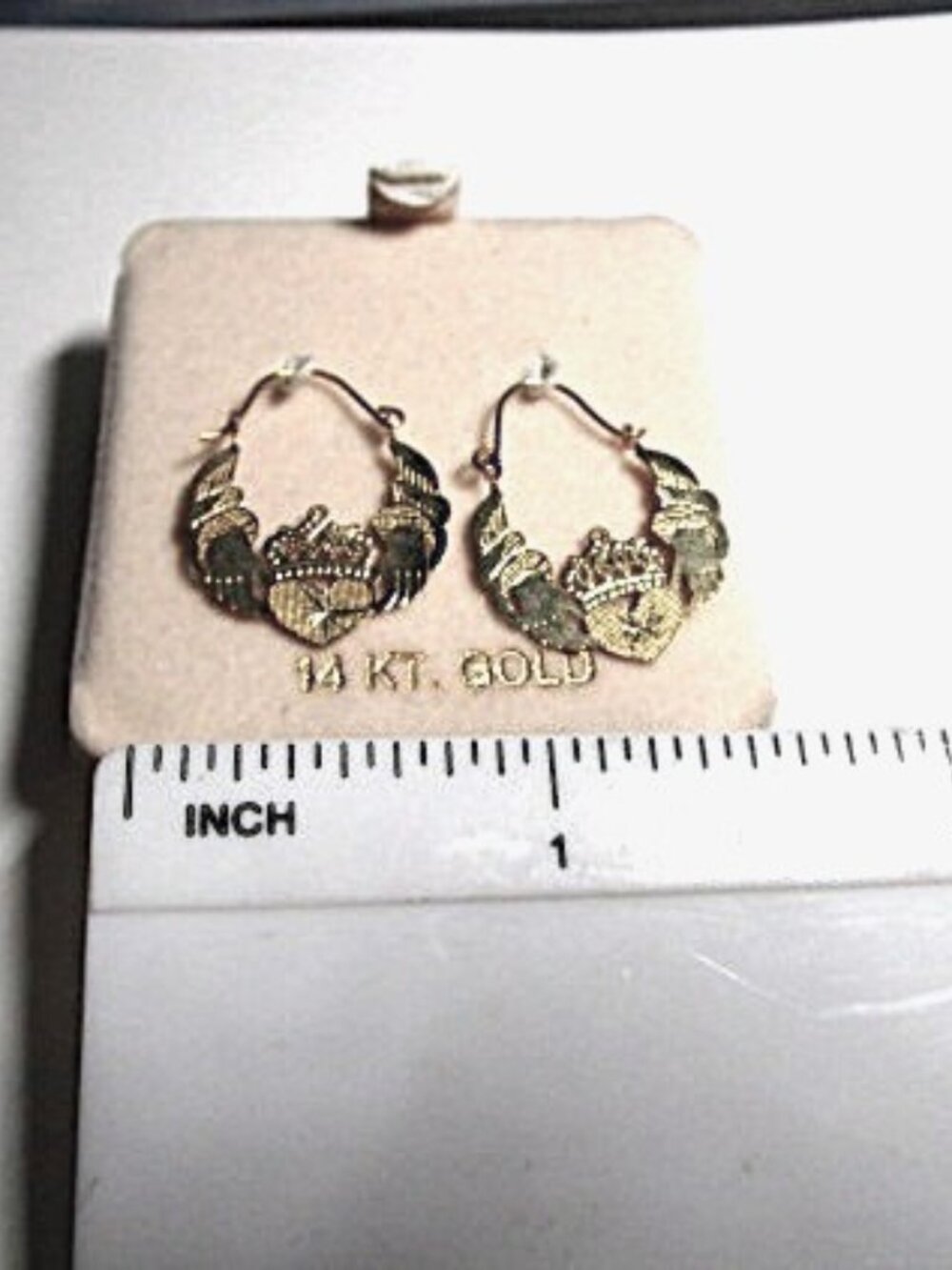 These 14k JCM Hands and Heart Hoop Earrings in Yellow Gold